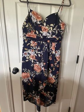 Floral Navy Sleeveless Midi Dress with Peach Blooms 
Lulu’s Brand